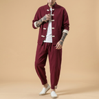 Xuanlong Tang Set in deep green, two-piece jacket and pants, full body front view