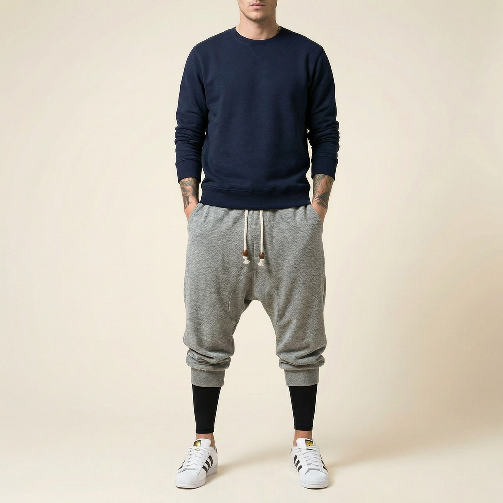 Qiren Flow Pants in heather grey, tapered drop crotch, front view