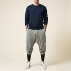 Qiren Flow Pants in heather grey, tapered drop crotch, front view